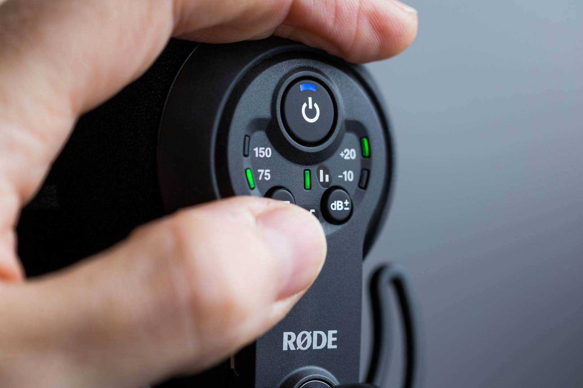 person holding black remote control